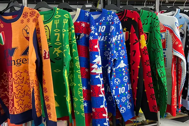 Large quantity of custom Christmas sweaters ready for bulk delivery