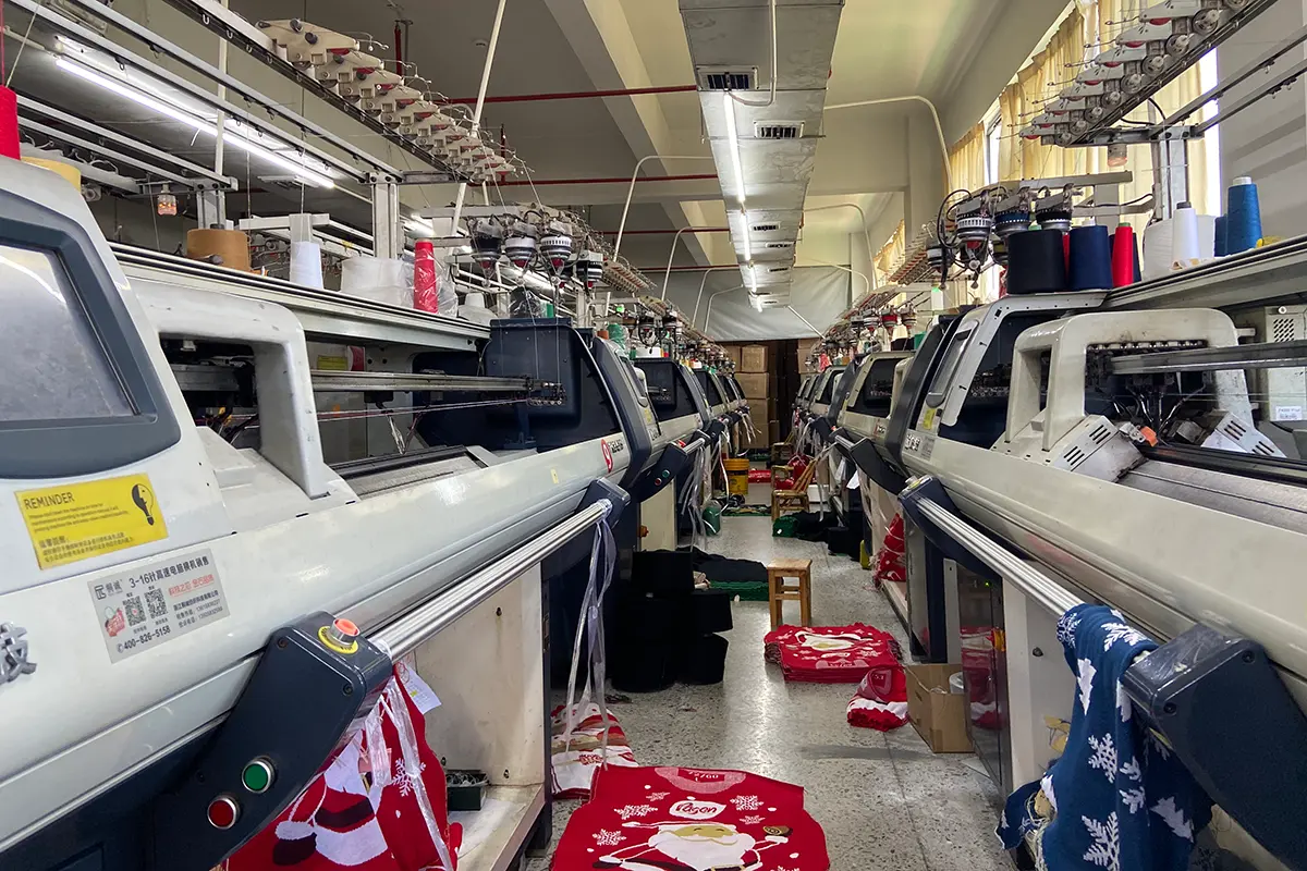 Knitting machine producing a Christmas sweater
