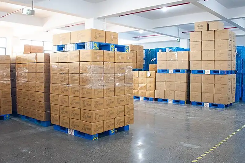 packed custom Christmas sweaters in warehouse awaiting shipment