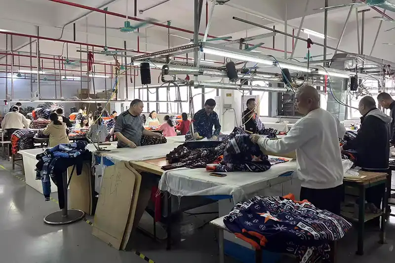 Low-impact production practices for custom christmas knitwear