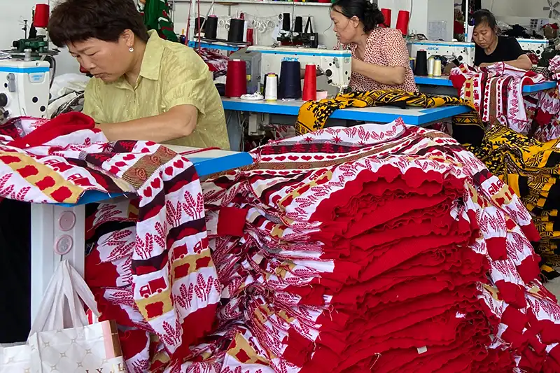 Bulk production process for custom Christmas sweaters at factory