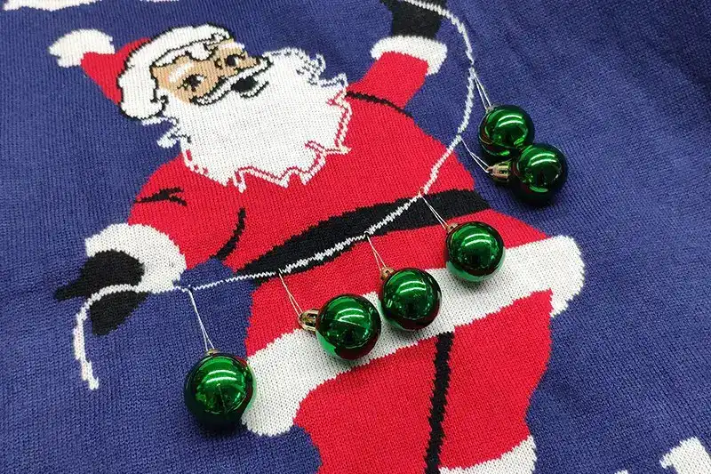 Hanging ball and ornament details on custom Christmas sweater