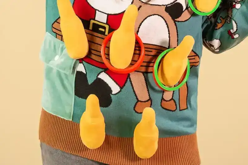 3D interactive ring toss design on custom Christmas sweater