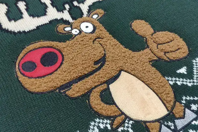 Towel embroidery craftsmanship on custom Christmas sweater