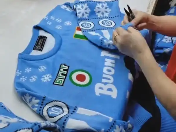 Quality control inspection during custom Christmas sweater manufacturing